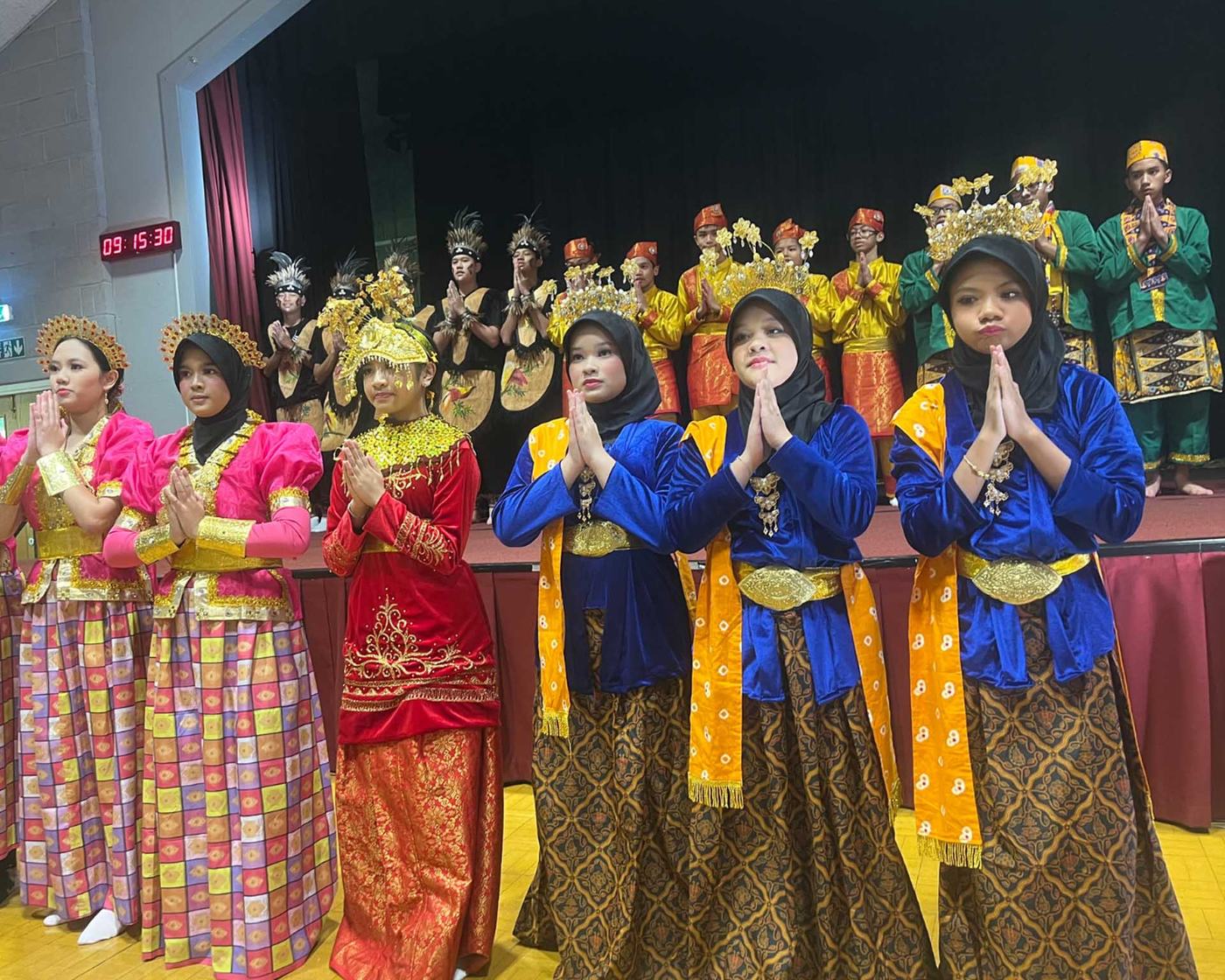 Students in traditional dress performing together